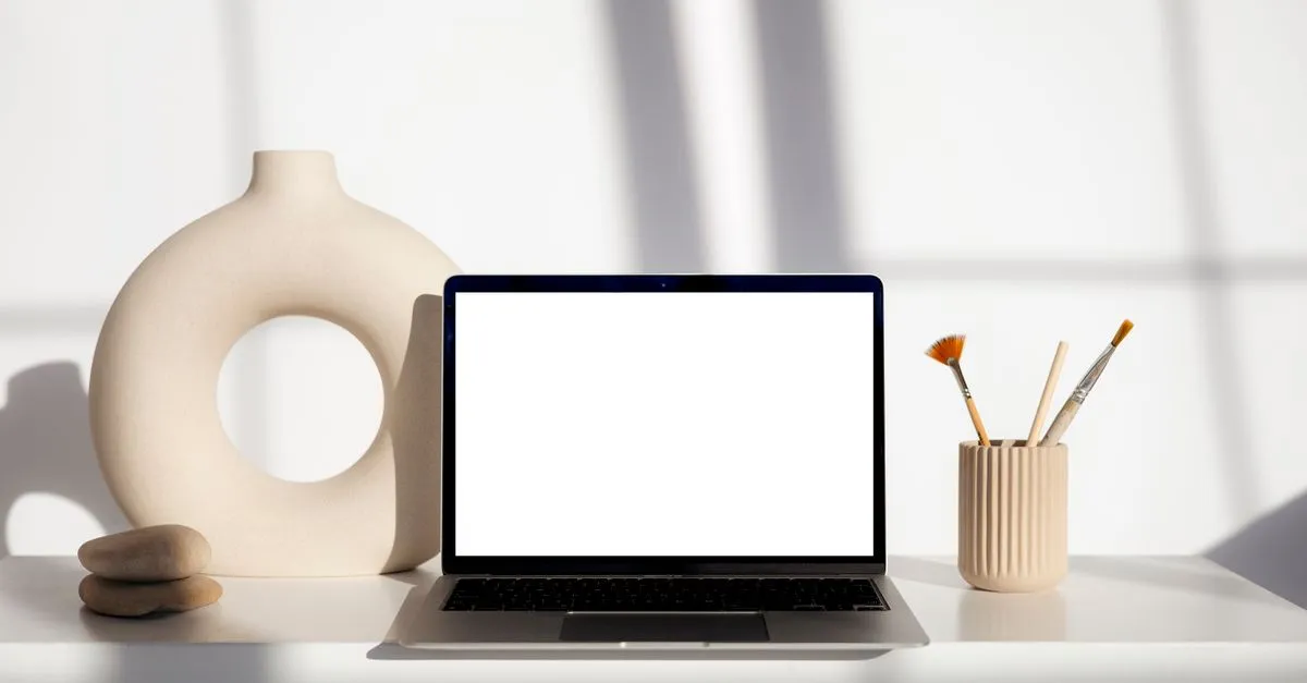 A laptop showing a blank screen, ready for a fast, modern law firm website design.