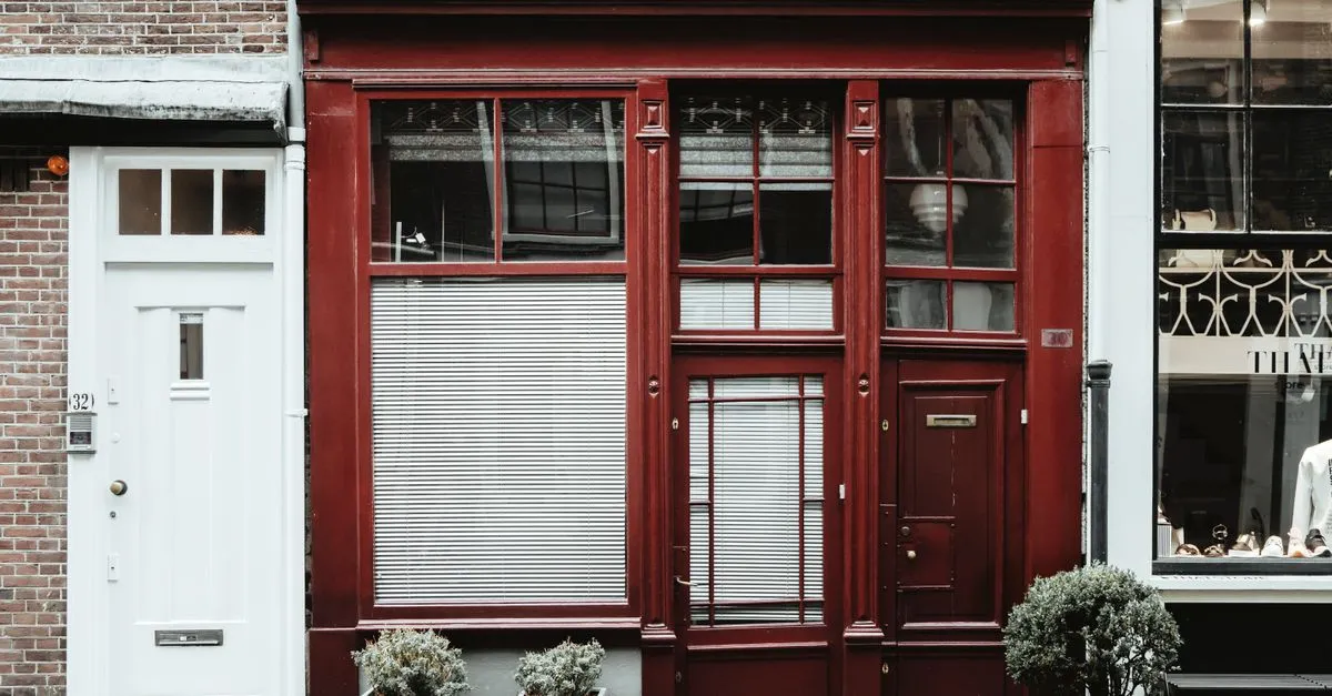 A red brick storefront with potted plants on a quiet Atlanta street, the kind of neighborhood business local SEO is built for.
