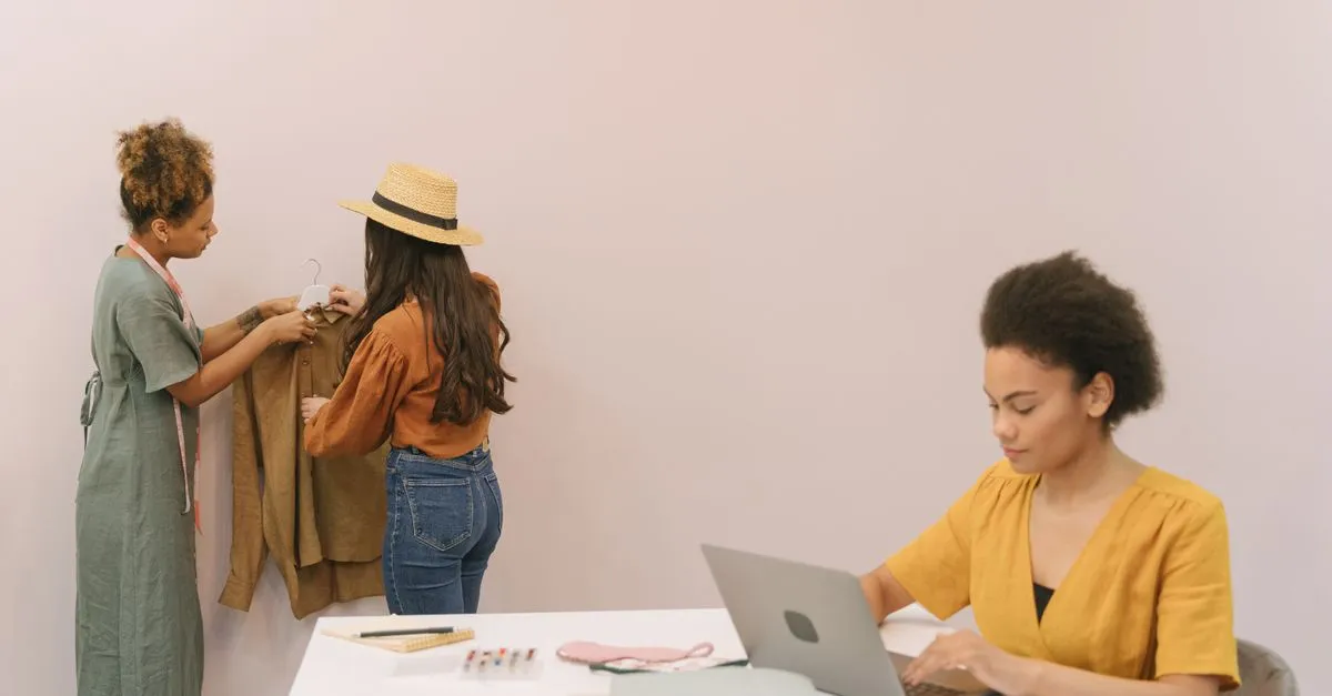 A small business team working together on laptops, planning where a limited marketing budget should go first.