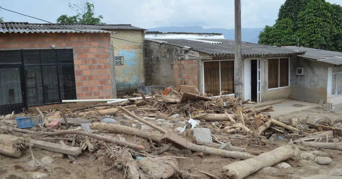Homes buried in flood debris and mud after a storm, the kind of large loss a multi-market restoration company handles.