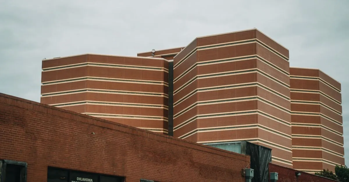Modern brick buildings under a cloudy Oklahoma sky in downtown Tulsa, the kind of local market local SEO is built for.