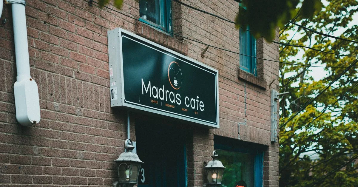 A local neighborhood cafe storefront in a brick building, the kind of small business that competes for the Columbus map pack.