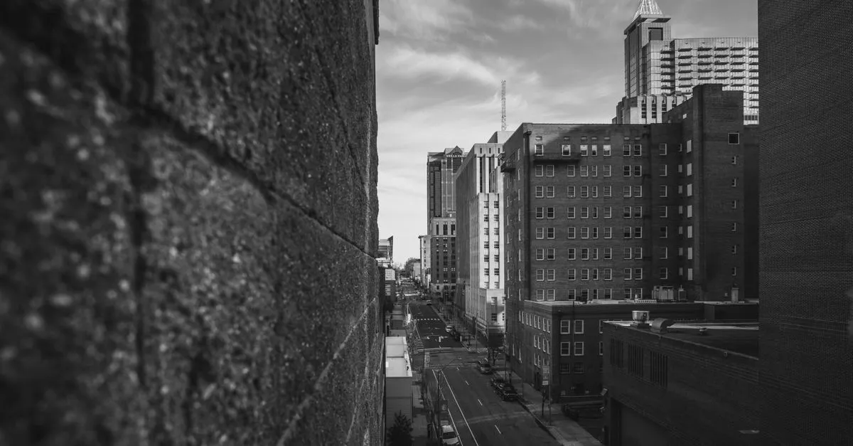 A downtown Raleigh street lined with brick buildings, the kind of local block where a city-level map pack ranking is decided.