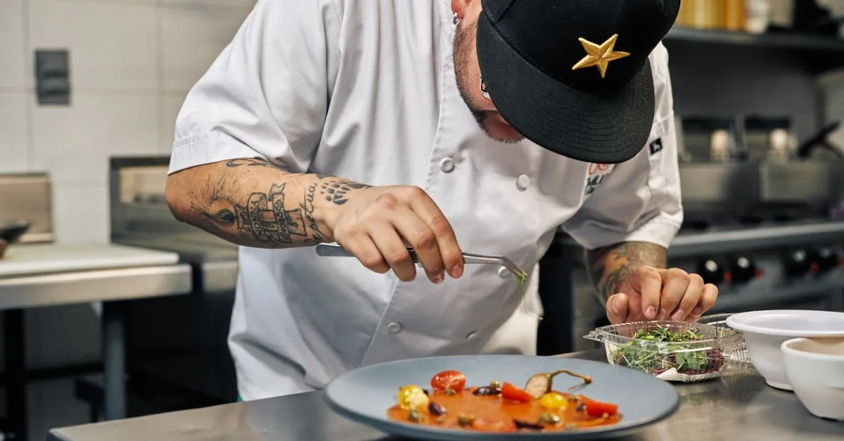 A chef plating a gourmet dish, the kind of signature food a restaurant SEO agency turns into menu pages that rank organically.