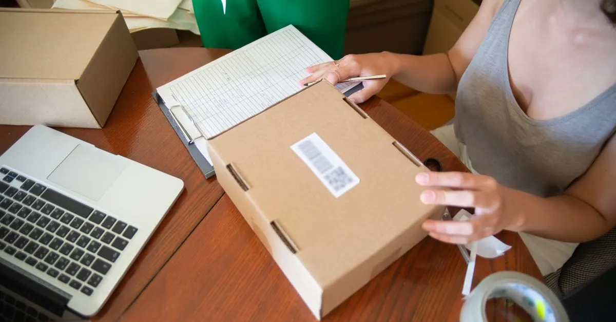 Two people packing online orders in a small ecommerce business.
