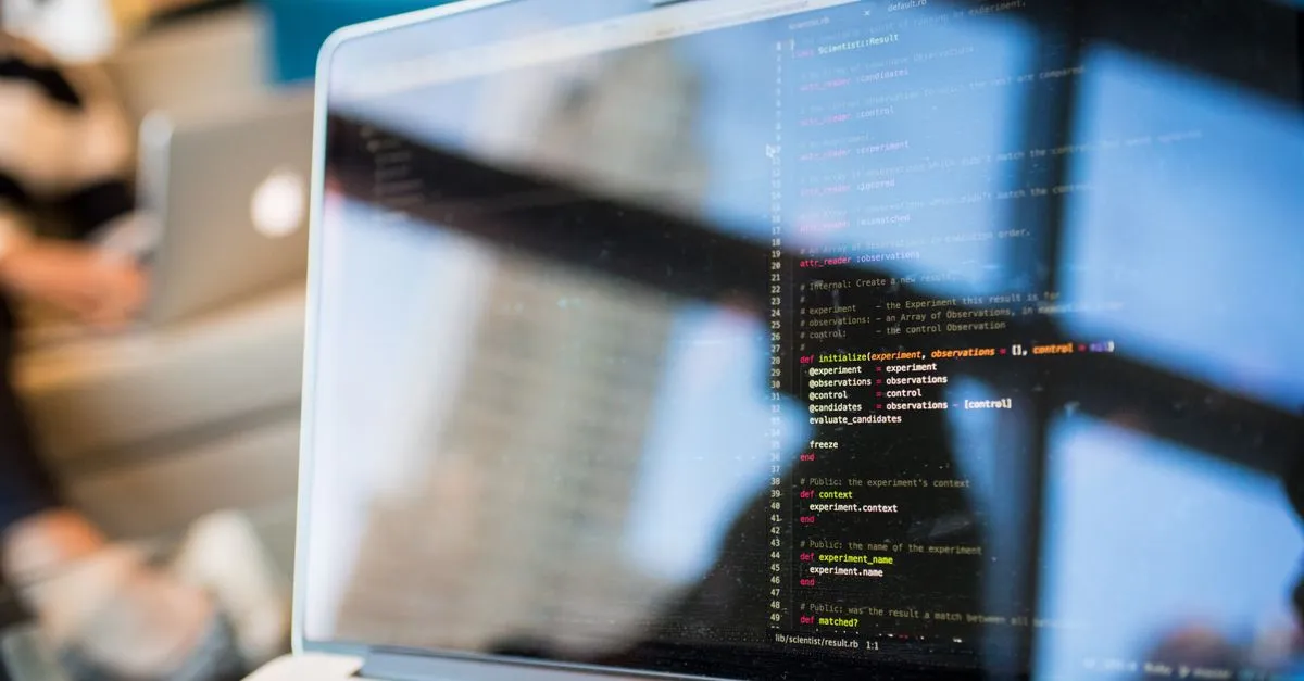 A laptop screen displaying lines of code, the real-code build behind a fast website.