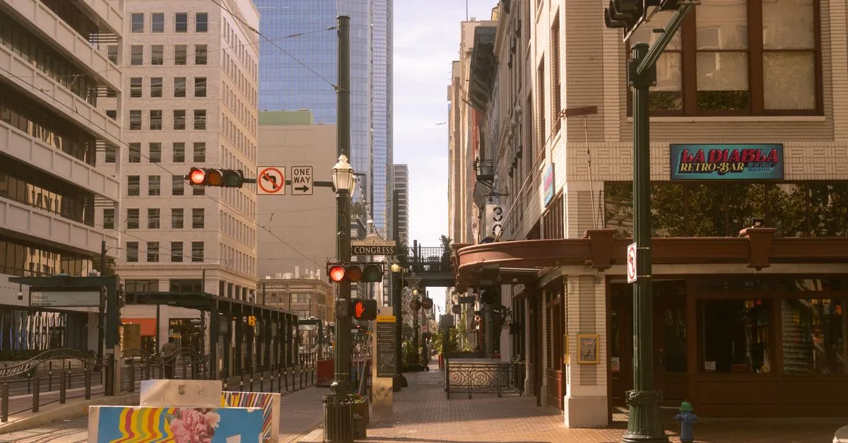 A quiet downtown Houston street corner in the historic district, with a local retro bar, storefronts, and a Congress Street sign, the kind of local market local SEO is built for.