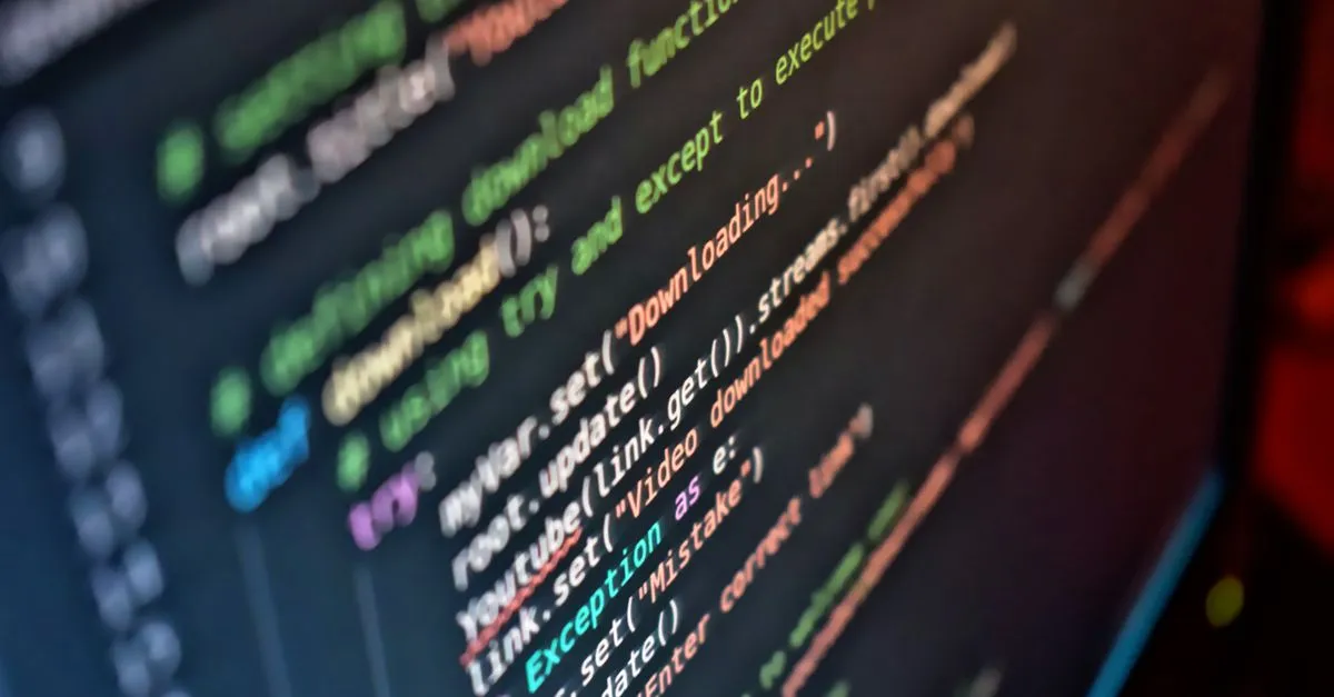 A close-up of colorful code on a dark computer screen, the real-code work behind a fast Phoenix website.