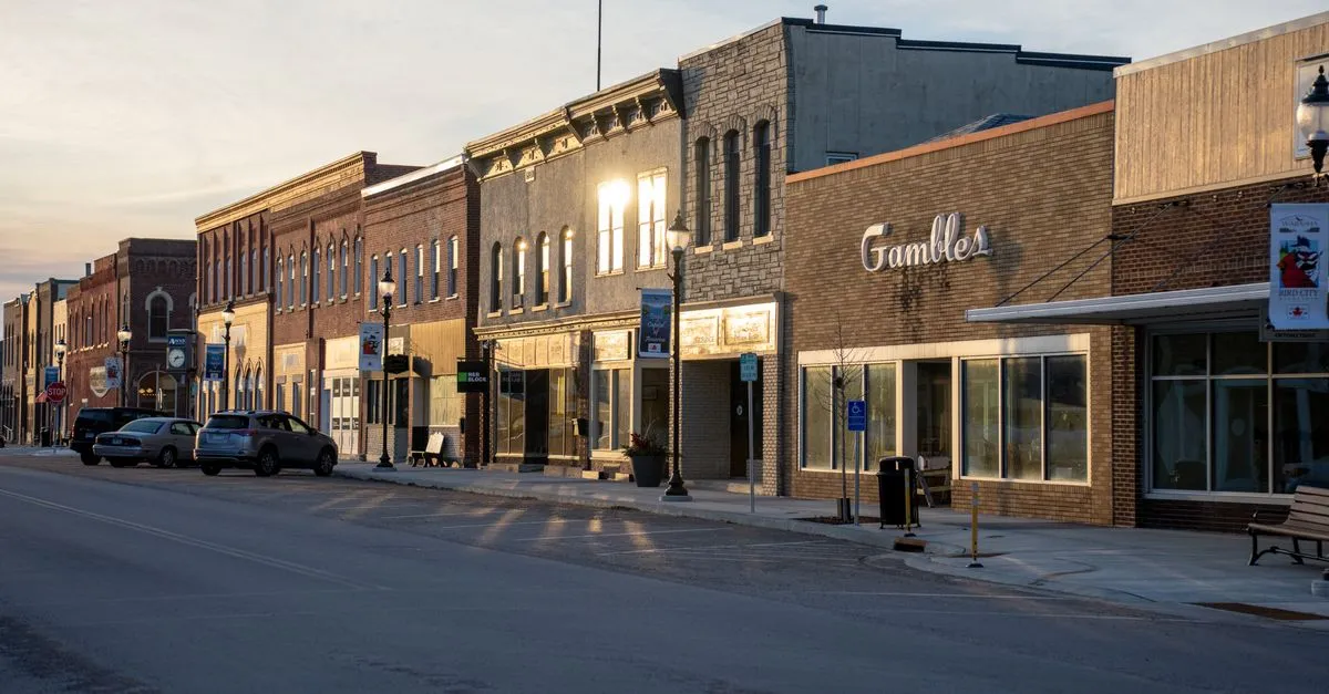 A brick Main Street of small-business storefronts in a Midwest suburban downtown, the kind of local business that competes for the Indianapolis map pack.