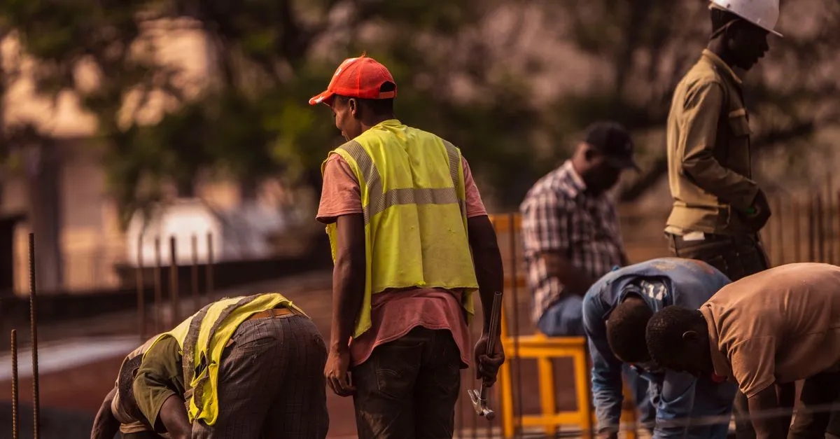 A crew of workers in safety gear on an active jobsite, the kind of work a contractor website puts in its gallery.