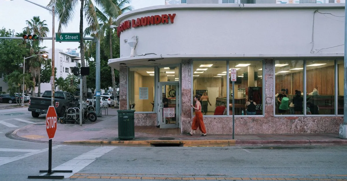 A corner laundromat and local business on a palm-lined Miami street, the kind of neighborhood storefront local SEO is built for.