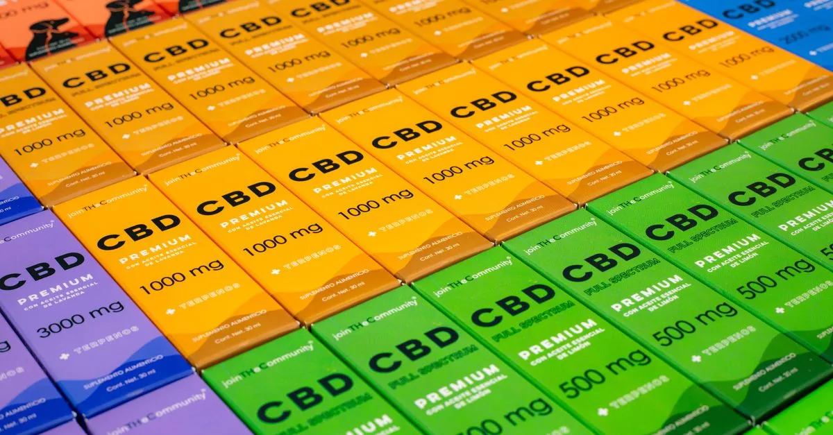 Cannabis retail products arranged in a neat display case at a licensed dispensary.