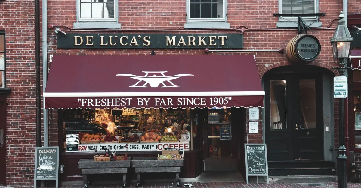 A historic brick storefront market in a Boston neighborhood, the kind of walkable local business local SEO is built for.