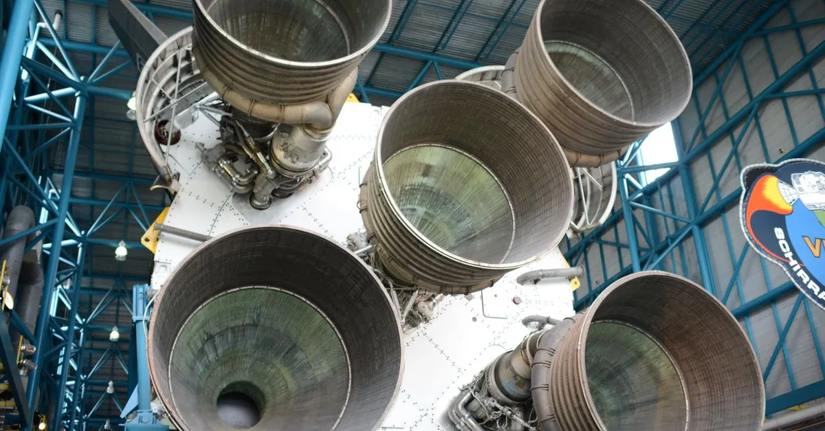 A close-up of the clustered F-1 engines at the base of a Saturn V rocket, the launch vehicle developed in Huntsville, on display in a space museum.