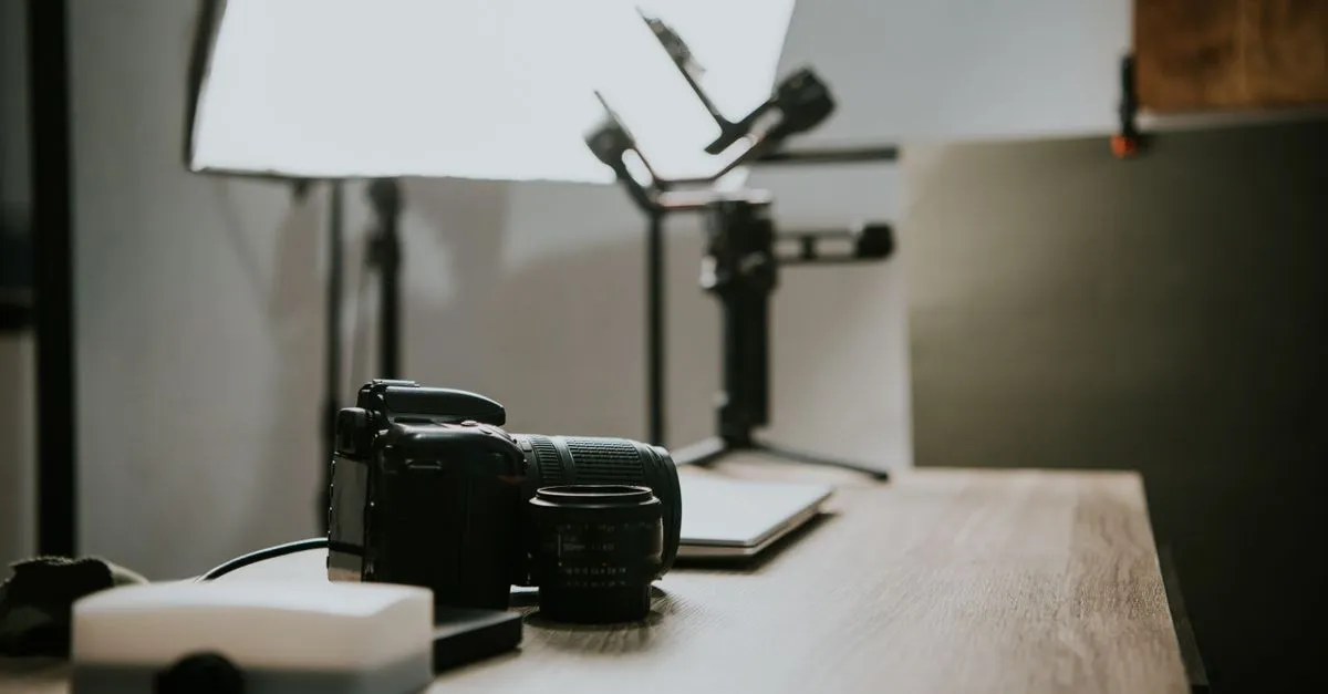 A DSLR camera and lens on a studio desk, the kind of image a photographer SEO page teaches Google to read.