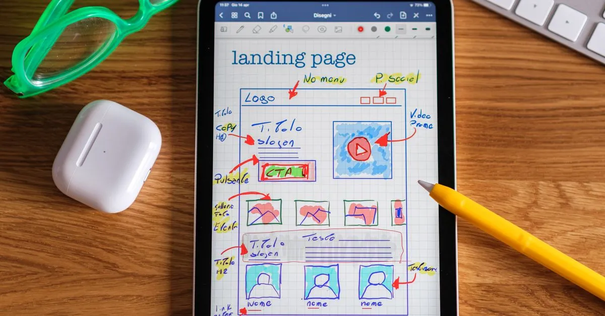 A tablet showing a hand-drawn landing page wireframe, the design work behind a Houston website.
