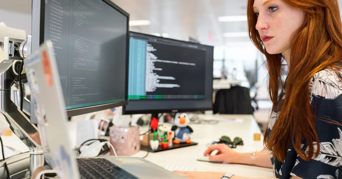 An engineer reviewing a website on a computer screen, the kind of fast B2B site a manufacturer web design is built around.