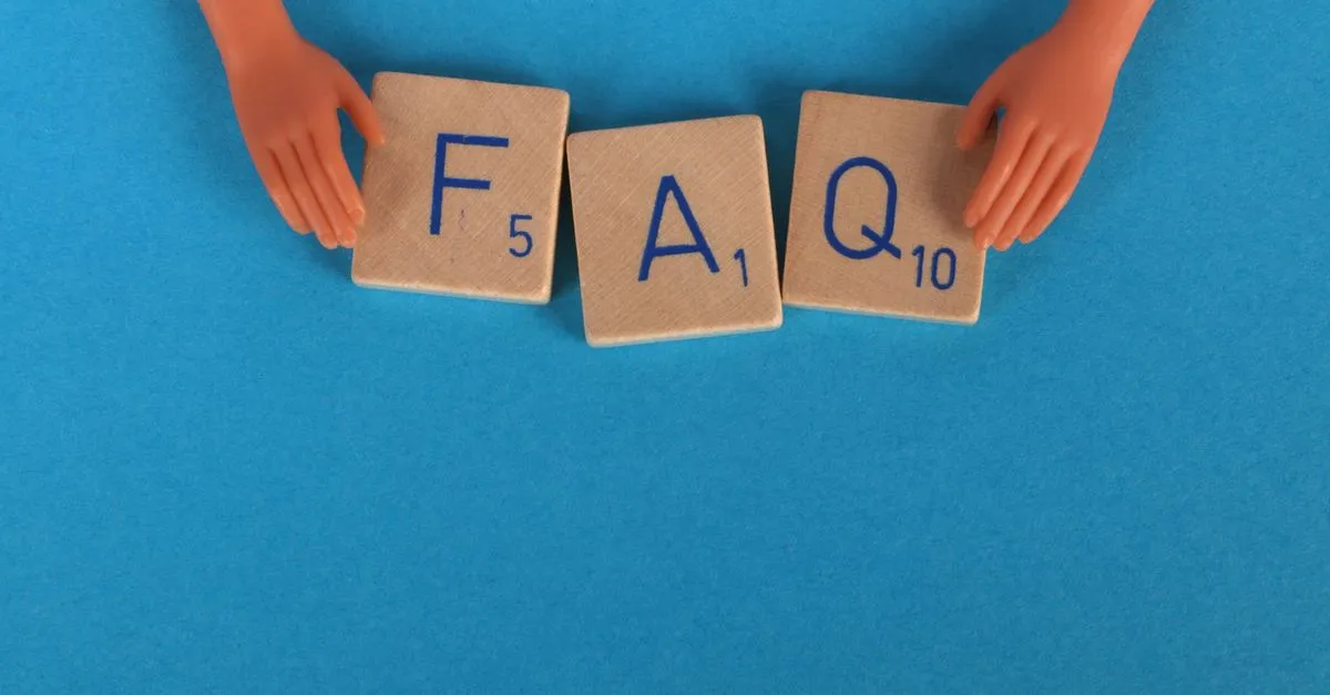 Scrabble-style tiles, a nod to the question-and-answer structure FAQ schema labels.