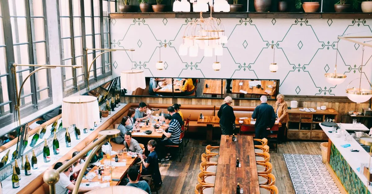 Diners eating inside a busy restaurant, the kind of spot local SEO for restaurants helps people find.