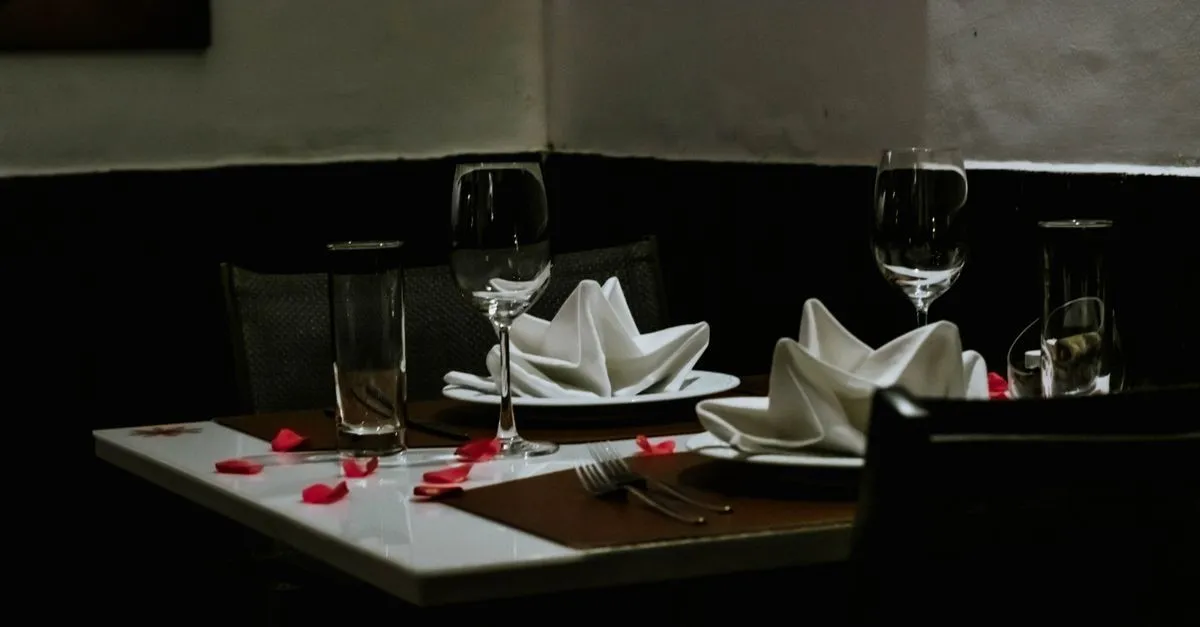 A restaurant table set for two with wine glasses, the kind of dining room a restaurant SEO agency helps people discover in organic search.