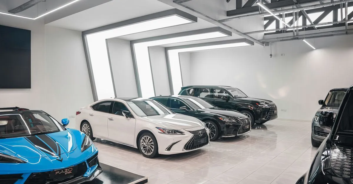 Luxury cars lined up in a modern dealership showroom, the kind of inventory automotive SEO helps shoppers find.