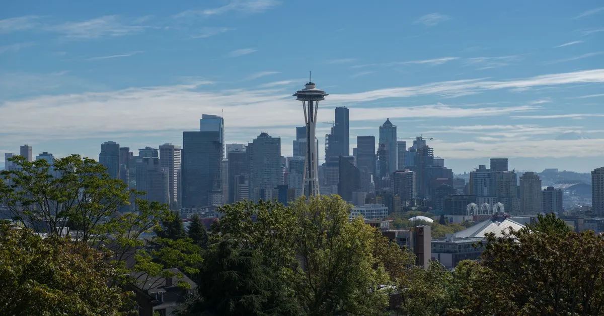The Seattle skyline with the Space Needle under a clear sky, the water-carved market where local SEO is won.