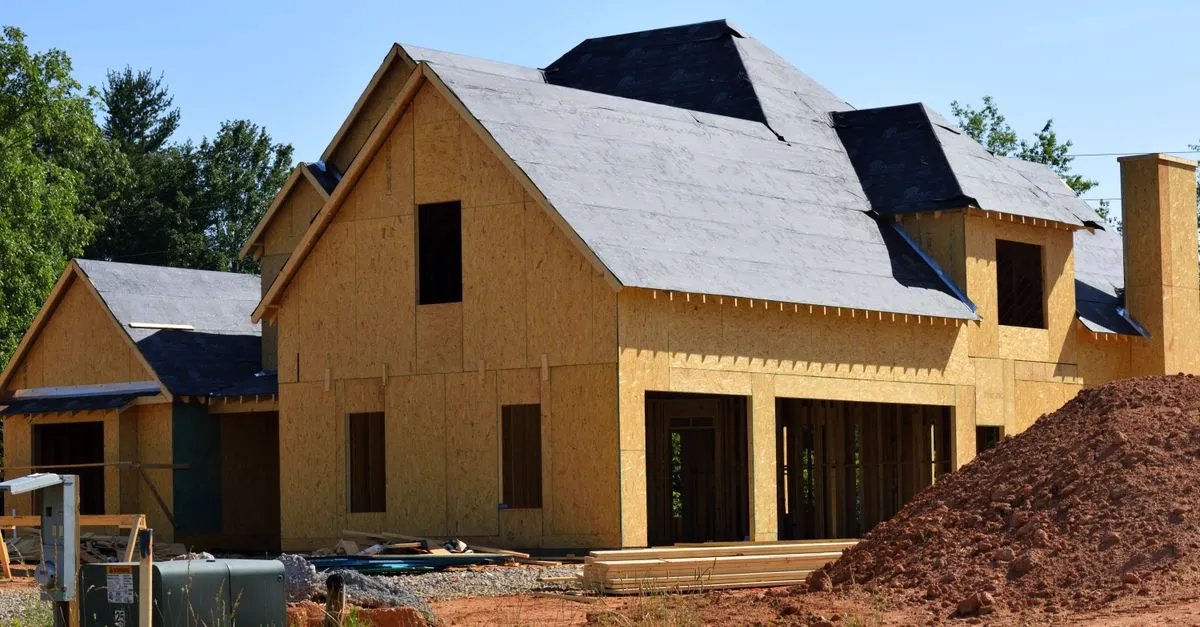 A new two-story home under construction with exposed wood framing, the kind of new build buyers search for online.