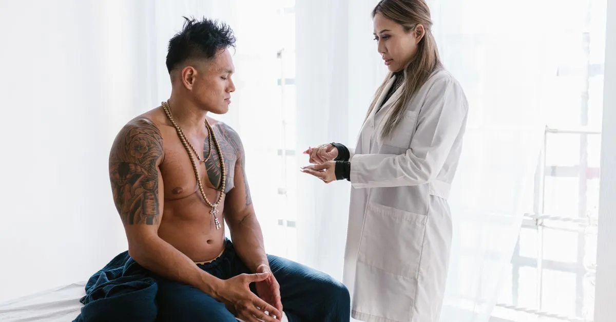 A doctor examining a patient in an exam room, the kind of medical practice local SEO for doctors helps patients find.