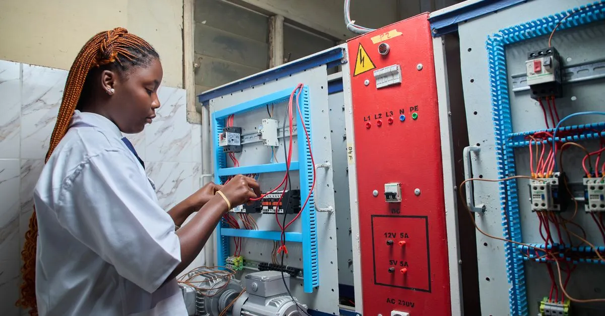 An electrician wiring a breaker panel, the kind of licensed pro websites for electricians are built to book.