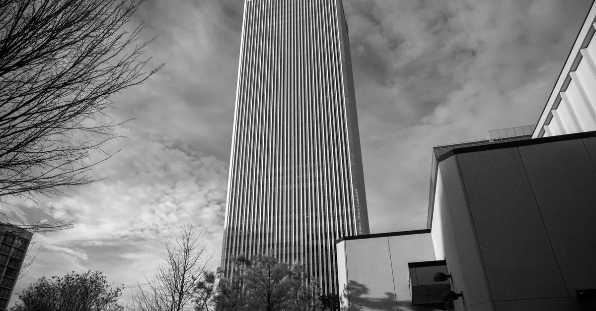 BOK Tower rising over downtown Tulsa in black and white, the landmark skyline of the local market where the map pack is won.