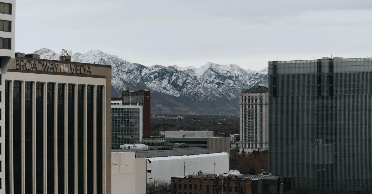 Downtown Salt Lake City office towers below the snow-capped Wasatch mountains.