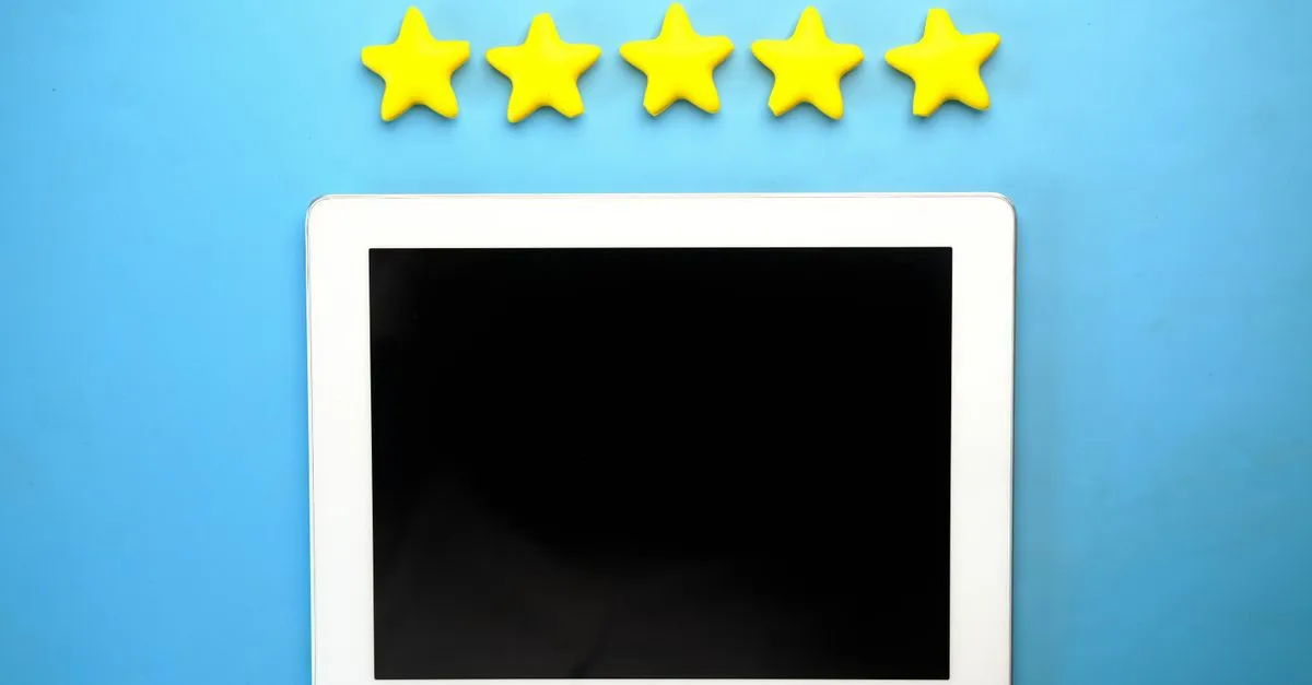 Five stars drawn on a blackboard, representing Google reviews for a local business.
