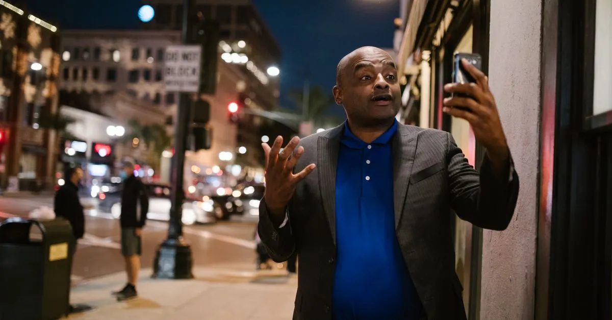 A person using a smartphone with a map on the screen, the near-me search that decides the Columbus map pack.