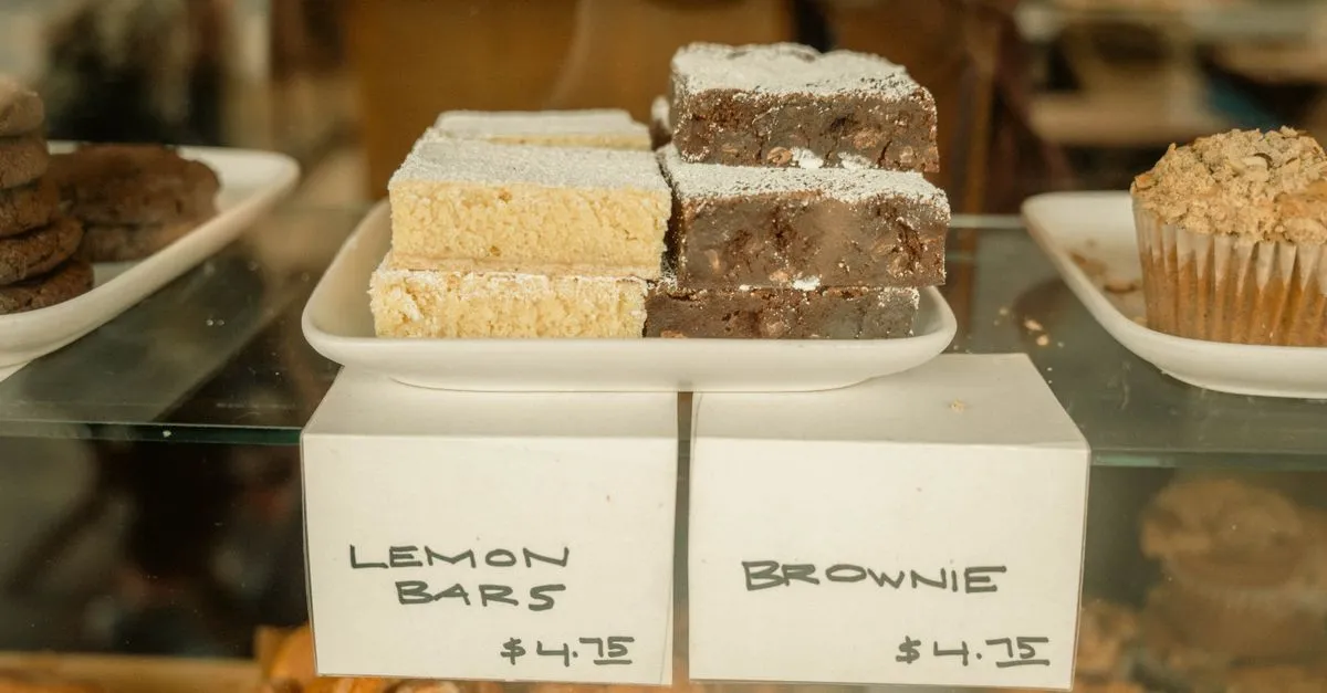 A bakery display case full of pastries and lemon bars with price tags, the kind of shop customers find through local search.