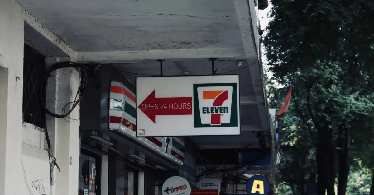 A row of franchise storefront signs on a city building, the kind of multi-location brand a franchise SEO company helps get found.