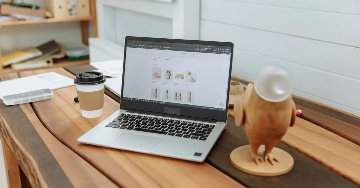 A laptop open to an online store on a wooden desk, the kind of Shopify shop a Shopify SEO company helps get found.