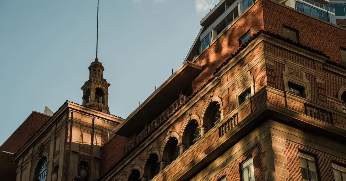 A historic brick building in downtown Phoenix, Arizona lit by warm sunset light, where local businesses compete for attention online.