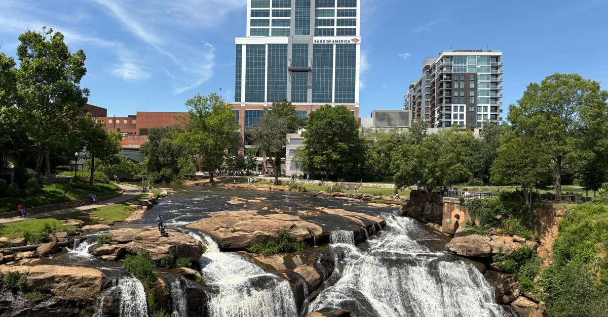 View of downtown Greenville with Reedy River Falls, a unique blend of nature and urban landscape.
