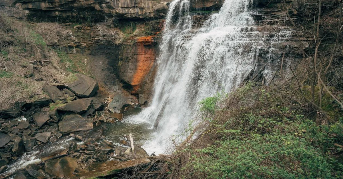 Brandywine Falls, a wide waterfall cascading over rock ledges in Cuyahoga Valley National Park just north of Akron, Ohio.