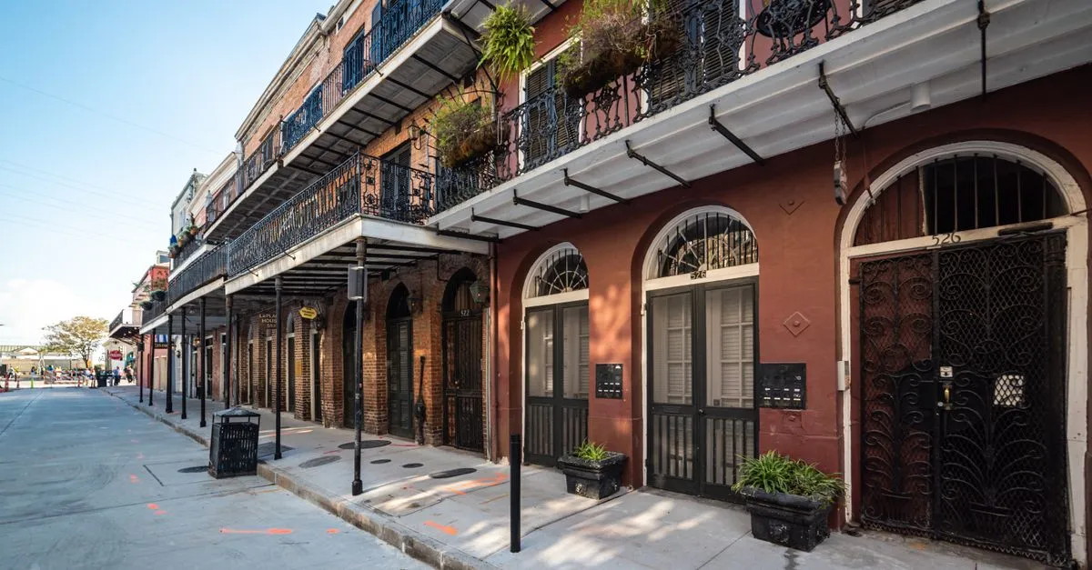 Historic French Quarter street in New Orleans lined with brick buildings and cast-iron balconies, the kind of local market the map pack is built for.