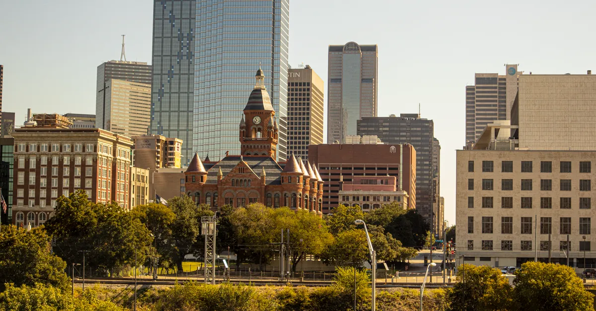 The Dallas skyline with the Old Red Museum and downtown high-rise towers where local businesses compete for attention online.