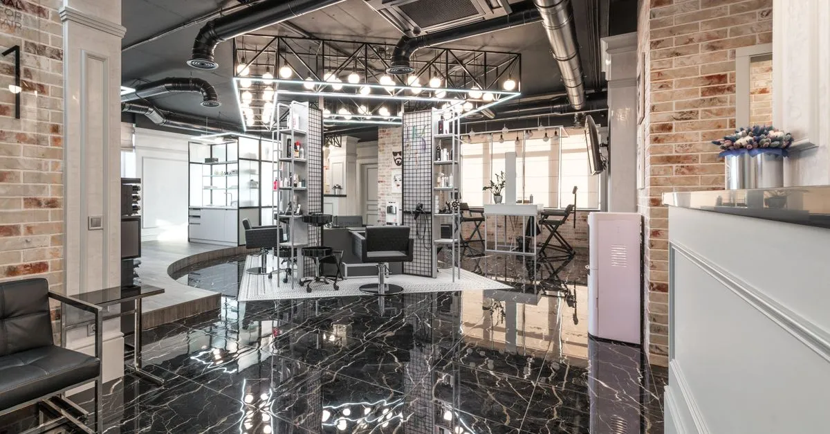 A modern med spa reception and treatment area with marble floors, the kind of clinic a med spa website is built to book.