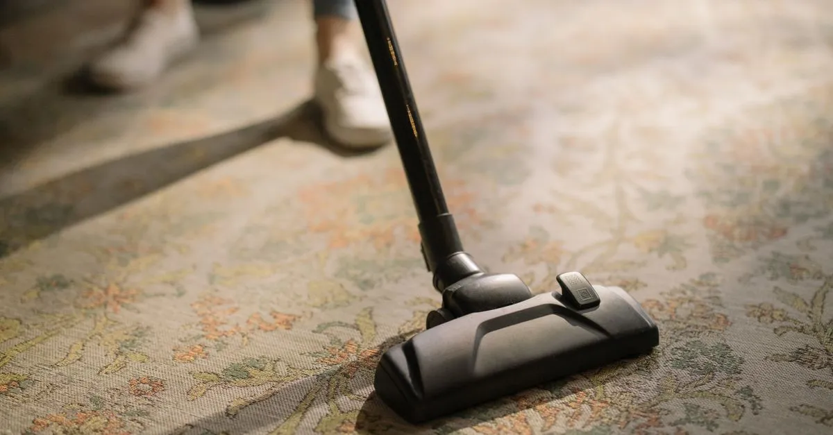A carpet cleaning machine running over a patterned area rug, the kind of company local SEO for carpet cleaners helps get found.