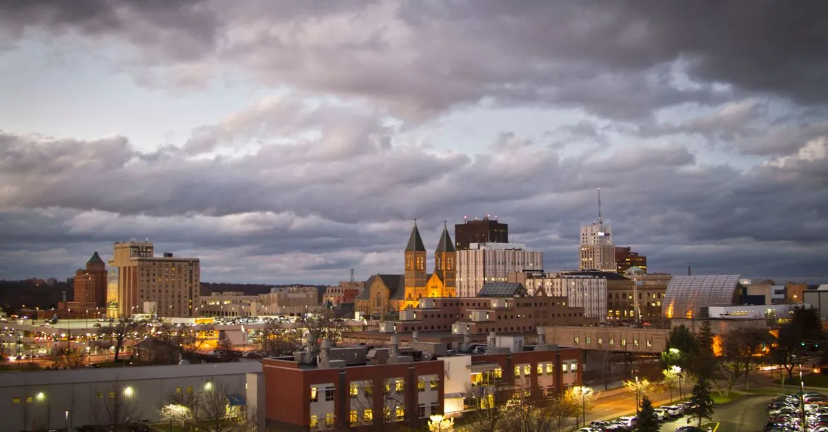 Moody view of downtown Akron, Ohio, under an overcast evening sky.