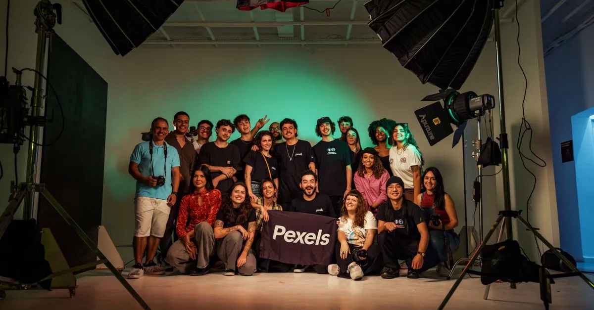 A creative agency team together in a studio, the kind of team an agency website is built to represent.