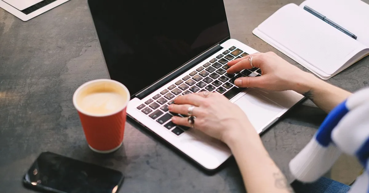 A designer working at a desk, shaping a business website.