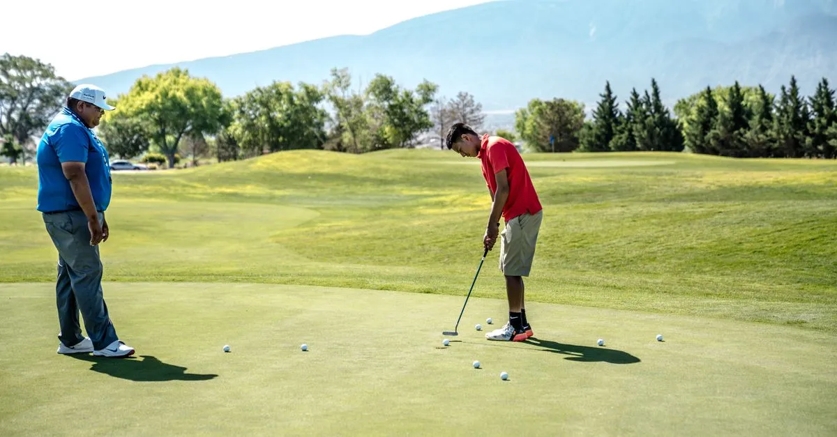 Two golfers on a sunny putting green with mountains in the distance, a nod to the resort golf the Scottsdale area is known for.