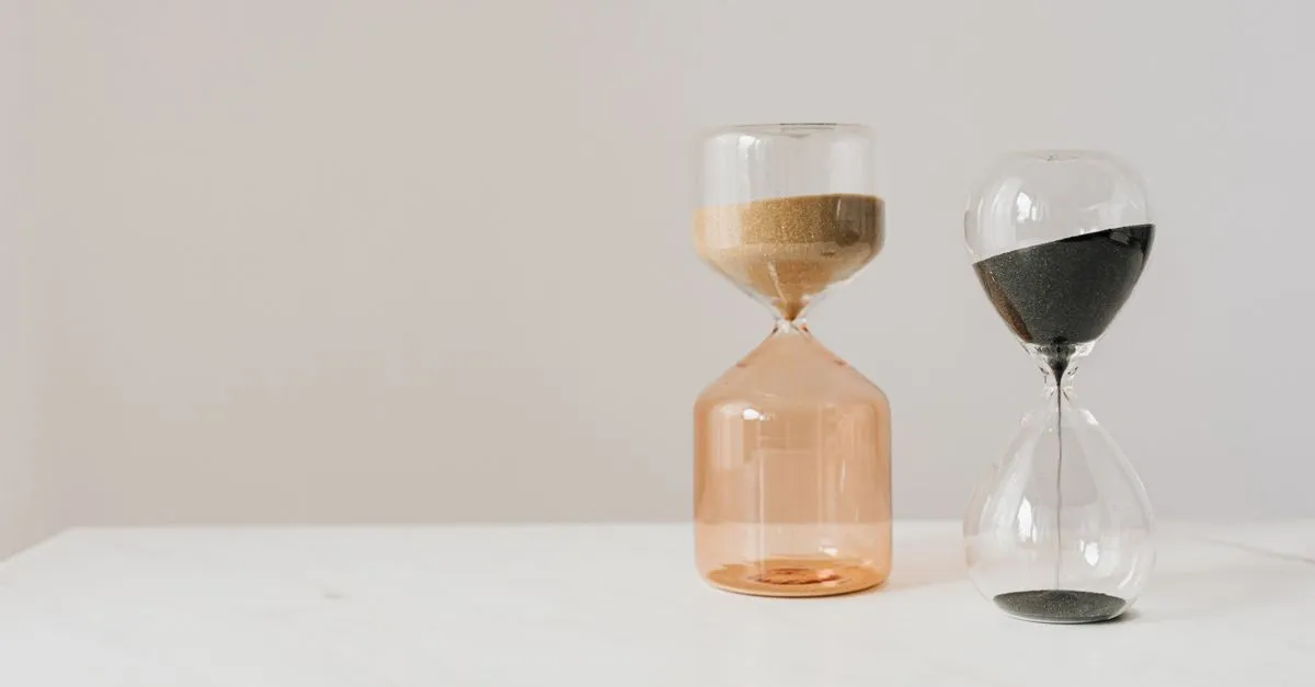 Hourglasses with pouring sand, representing how long SEO takes to rank in Google.