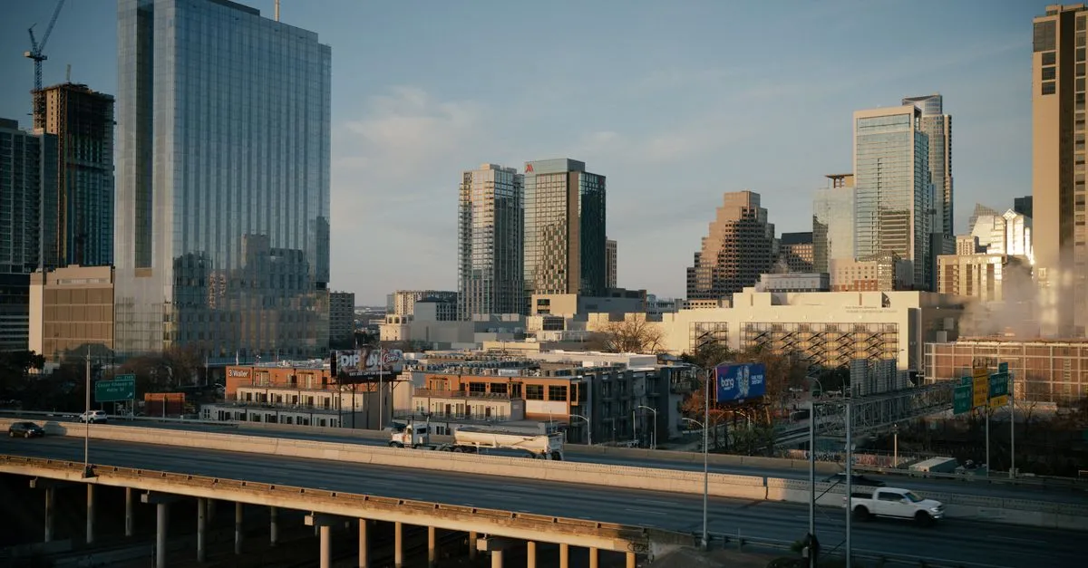Downtown Austin, Texas at golden hour above the elevated lanes of I-35, the sprawling metro where the local map pack is won.