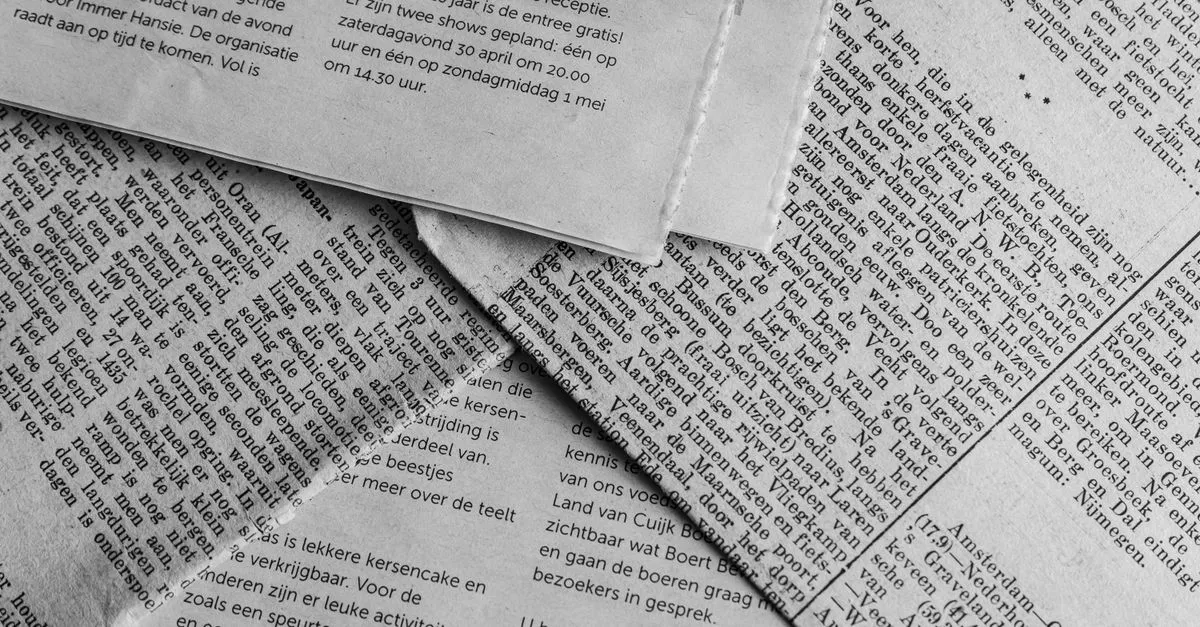 Black and white close-up of stacked newspaper pages, standing in for the third-party press and mentions AI search engines trust.